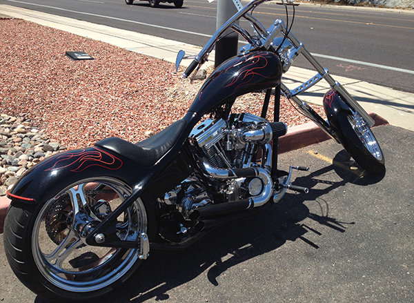 Custom black chopper motorcycle with red flame pinstriping