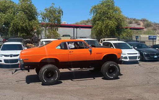 Orange lifted Chevrolet Nova